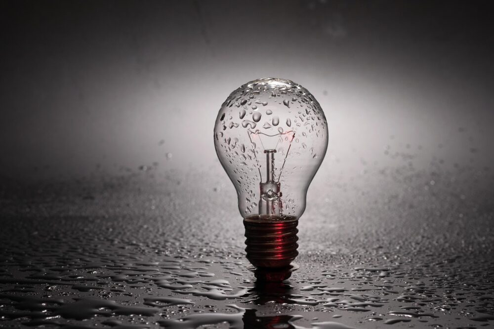 A Light Bulb Covered With Raindrops