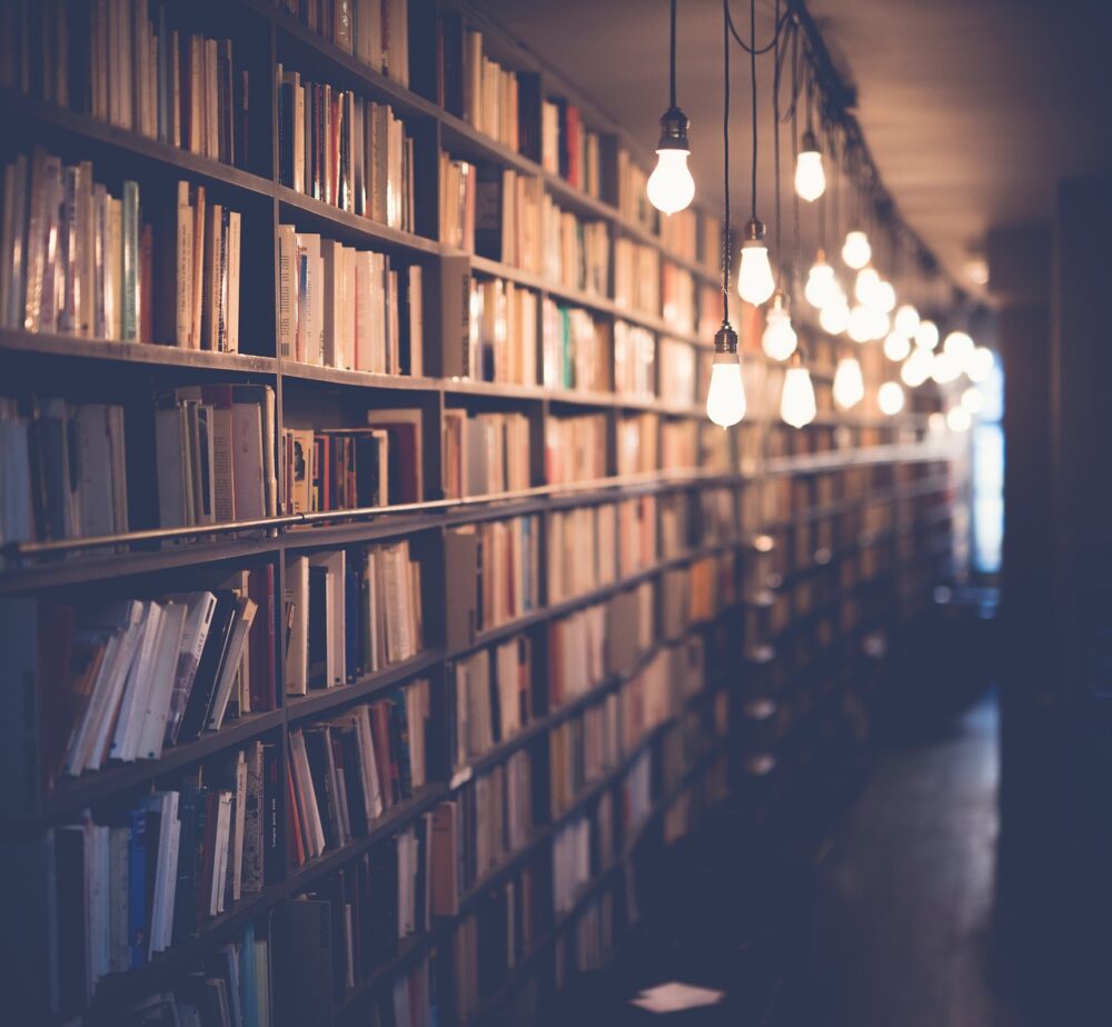 A Row OF Bookshelves In An Old Room