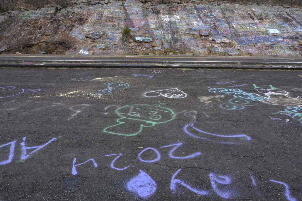 Graffiti on the road and on the rocks at Grand View Vista, Talimena Scenic Drive, Arkansas