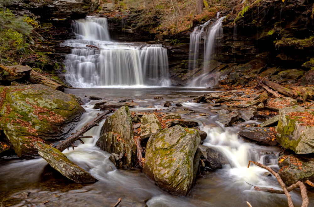 Foreground Rocks And Debris At RB Ricketts Falls View From The Footbridge In Autumn At Ricketts Glen State Park PA